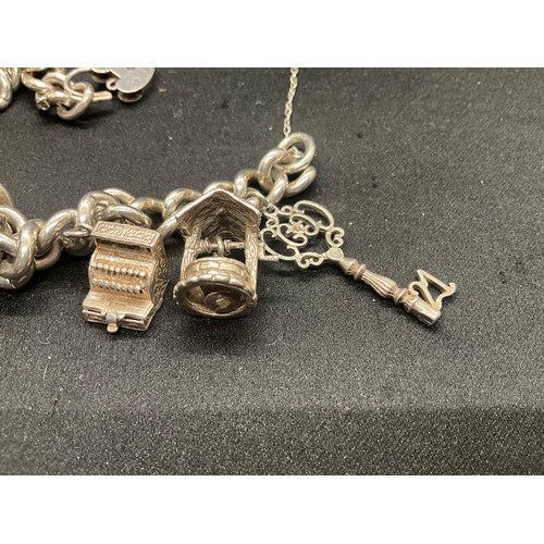 6 - HALLMARKED SILVER CHARM BRACELET WITH 9 SILVER & WHITE METAL CHARMS W68.6G - LOCKET IS ENGLISH HALLM... 