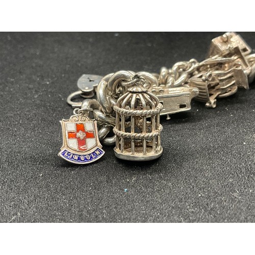 6 - HALLMARKED SILVER CHARM BRACELET WITH 9 SILVER & WHITE METAL CHARMS W68.6G - LOCKET IS ENGLISH HALLM... 