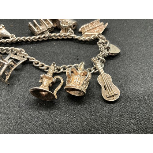 7 - SILVER CHARM BRACELET UNMARKED BUT TESTED WITH 13 SILVER CHARMS W50G - CONTINENTAL SILVER LOCKET,