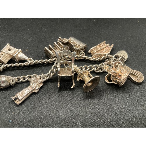 7 - SILVER CHARM BRACELET UNMARKED BUT TESTED WITH 13 SILVER CHARMS W50G - CONTINENTAL SILVER LOCKET,