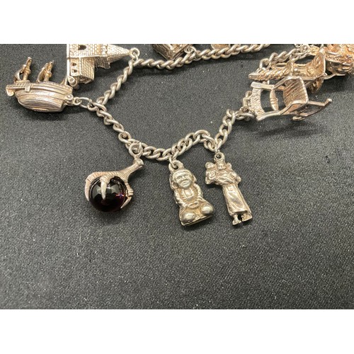 7 - SILVER CHARM BRACELET UNMARKED BUT TESTED WITH 13 SILVER CHARMS W50G - CONTINENTAL SILVER LOCKET,