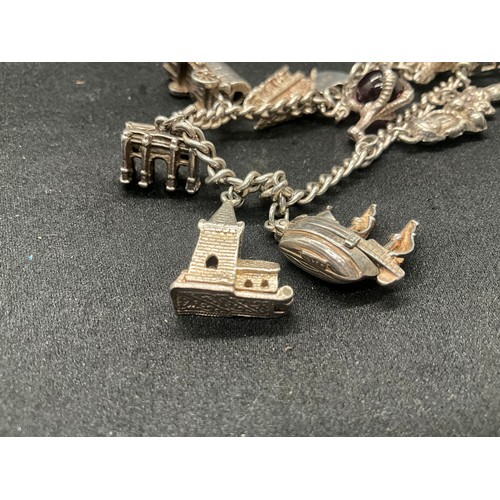 7 - SILVER CHARM BRACELET UNMARKED BUT TESTED WITH 13 SILVER CHARMS W50G - CONTINENTAL SILVER LOCKET,