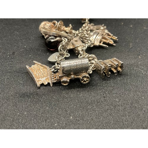7 - SILVER CHARM BRACELET UNMARKED BUT TESTED WITH 13 SILVER CHARMS W50G - CONTINENTAL SILVER LOCKET,