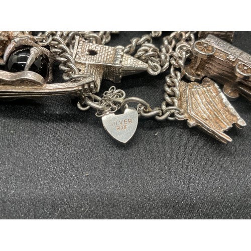 7 - SILVER CHARM BRACELET UNMARKED BUT TESTED WITH 13 SILVER CHARMS W50G - CONTINENTAL SILVER LOCKET,