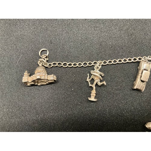 8 - 2 SILVER CHARM BRACELETS UNMARKED CHAIN BUT TESTED WITH A TOTAL OF 33 SILVER CHARMS W83.6G - 1 CHARM... 