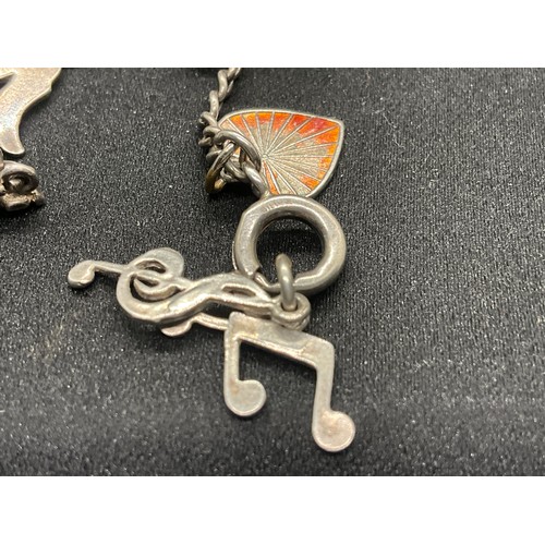 8 - 2 SILVER CHARM BRACELETS UNMARKED CHAIN BUT TESTED WITH A TOTAL OF 33 SILVER CHARMS W83.6G - 1 CHARM... 