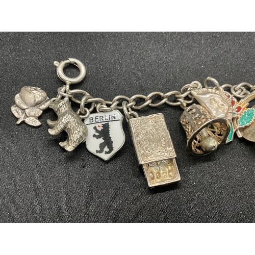 8 - 2 SILVER CHARM BRACELETS UNMARKED CHAIN BUT TESTED WITH A TOTAL OF 33 SILVER CHARMS W83.6G - 1 CHARM... 