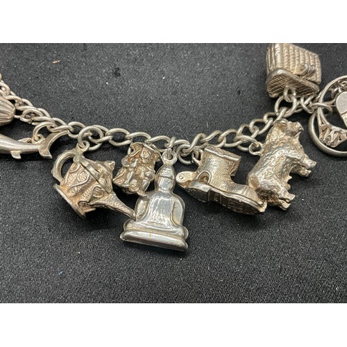 8 - 2 SILVER CHARM BRACELETS UNMARKED CHAIN BUT TESTED WITH A TOTAL OF 33 SILVER CHARMS W83.6G - 1 CHARM... 