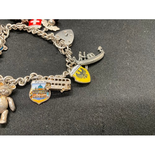 10 - 2 HALLMARKED SILVER CHARM BRACELETS WITH A TOTAL OF 33 SILVER CHARMS TW92.4G
BOTH ENGLISH HALLMARK S... 
