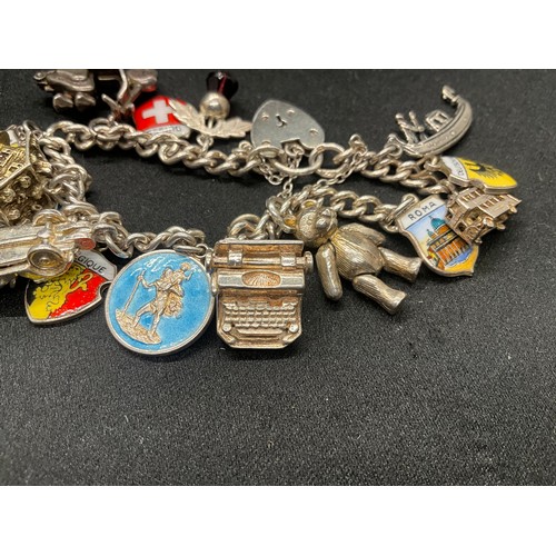 10 - 2 HALLMARKED SILVER CHARM BRACELETS WITH A TOTAL OF 33 SILVER CHARMS TW92.4G
BOTH ENGLISH HALLMARK S... 