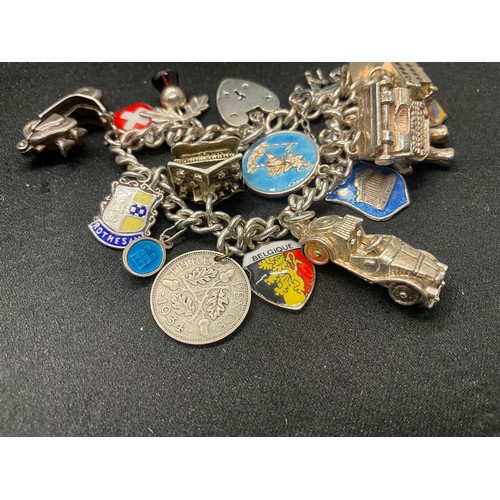 10 - 2 HALLMARKED SILVER CHARM BRACELETS WITH A TOTAL OF 33 SILVER CHARMS TW92.4G
BOTH ENGLISH HALLMARK S... 