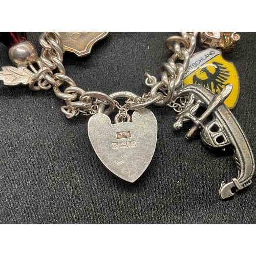 10 - 2 HALLMARKED SILVER CHARM BRACELETS WITH A TOTAL OF 33 SILVER CHARMS TW92.4G
BOTH ENGLISH HALLMARK S... 