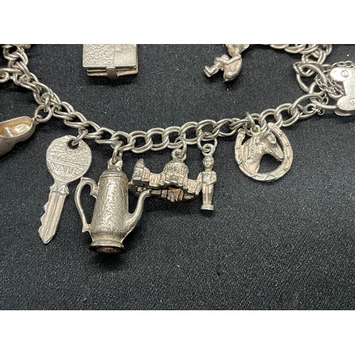 10 - 2 HALLMARKED SILVER CHARM BRACELETS WITH A TOTAL OF 33 SILVER CHARMS TW92.4G
BOTH ENGLISH HALLMARK S... 