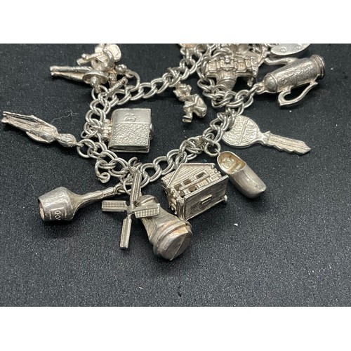 10 - 2 HALLMARKED SILVER CHARM BRACELETS WITH A TOTAL OF 33 SILVER CHARMS TW92.4G
BOTH ENGLISH HALLMARK S... 