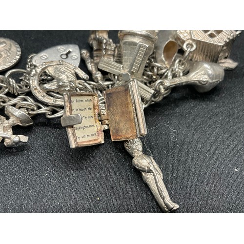 10 - 2 HALLMARKED SILVER CHARM BRACELETS WITH A TOTAL OF 33 SILVER CHARMS TW92.4G
BOTH ENGLISH HALLMARK S... 
