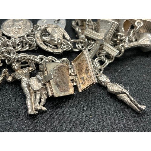 10 - 2 HALLMARKED SILVER CHARM BRACELETS WITH A TOTAL OF 33 SILVER CHARMS TW92.4G
BOTH ENGLISH HALLMARK S... 