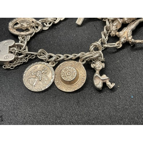10 - 2 HALLMARKED SILVER CHARM BRACELETS WITH A TOTAL OF 33 SILVER CHARMS TW92.4G
BOTH ENGLISH HALLMARK S... 