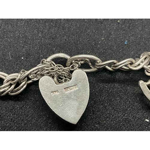 10 - 2 HALLMARKED SILVER CHARM BRACELETS WITH A TOTAL OF 33 SILVER CHARMS TW92.4G
BOTH ENGLISH HALLMARK S... 
