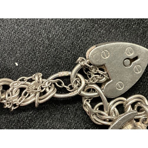 10 - 2 HALLMARKED SILVER CHARM BRACELETS WITH A TOTAL OF 33 SILVER CHARMS TW92.4G
BOTH ENGLISH HALLMARK S... 