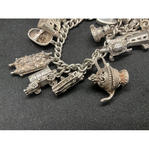 12 - ENGLISH HALLMARKED SILVER CHARM BRACELET WITH 15 SILVER CHARMS TW78.2G - LOCKET CONTINENTAL STAMPED ... 