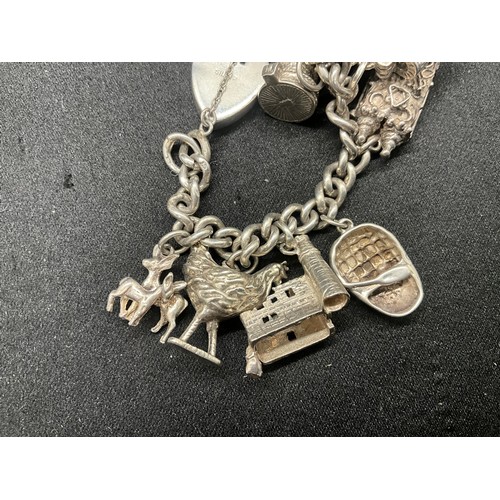 12 - ENGLISH HALLMARKED SILVER CHARM BRACELET WITH 15 SILVER CHARMS TW78.2G - LOCKET CONTINENTAL STAMPED ... 