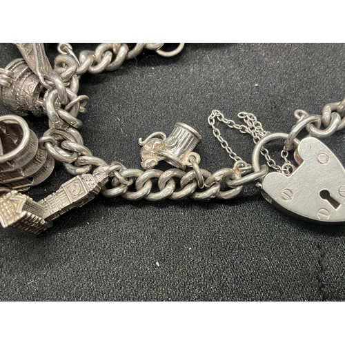 12 - ENGLISH HALLMARKED SILVER CHARM BRACELET WITH 15 SILVER CHARMS TW78.2G - LOCKET CONTINENTAL STAMPED ... 