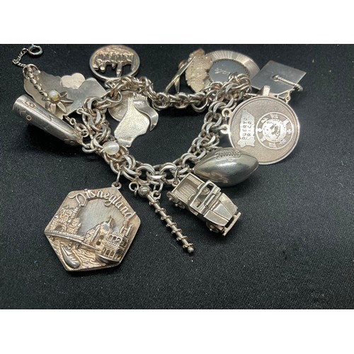 14 - STERLING SILVER CHARM BRACELET WITH 14 SILVER CHARMS TW75.7G - ADDITIONAL 3 CHARMS NOT SILVER