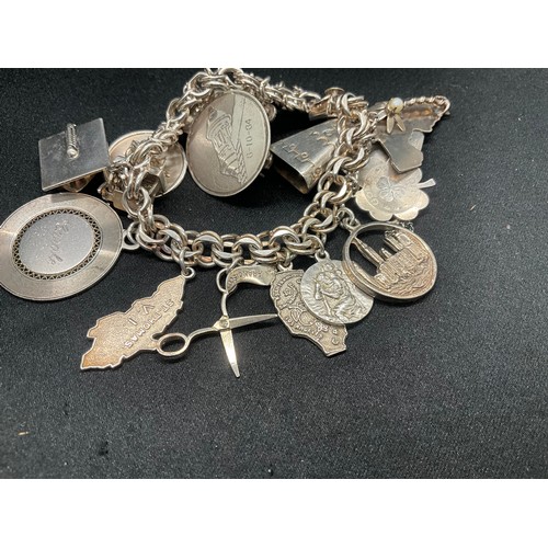 14 - STERLING SILVER CHARM BRACELET WITH 14 SILVER CHARMS TW75.7G - ADDITIONAL 3 CHARMS NOT SILVER