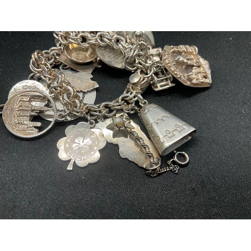 14 - STERLING SILVER CHARM BRACELET WITH 14 SILVER CHARMS TW75.7G - ADDITIONAL 3 CHARMS NOT SILVER