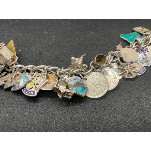 15 - HALLMARKED SILVER CHARM BRACLET WITH 37 SILVER CHARMS & 4 ADDITIONAL CHARMS NOT SILVER W76.1G