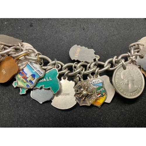 15 - HALLMARKED SILVER CHARM BRACLET WITH 37 SILVER CHARMS & 4 ADDITIONAL CHARMS NOT SILVER W76.1G