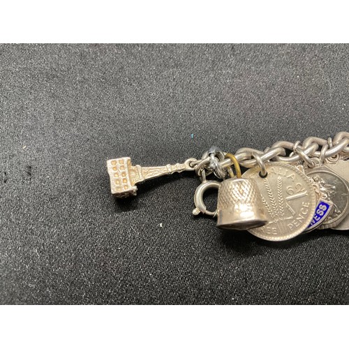 15 - HALLMARKED SILVER CHARM BRACLET WITH 37 SILVER CHARMS & 4 ADDITIONAL CHARMS NOT SILVER W76.1G