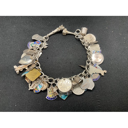 15 - HALLMARKED SILVER CHARM BRACLET WITH 37 SILVER CHARMS & 4 ADDITIONAL CHARMS NOT SILVER W76.1G
