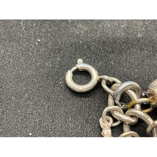 15 - HALLMARKED SILVER CHARM BRACLET WITH 37 SILVER CHARMS & 4 ADDITIONAL CHARMS NOT SILVER W76.1G
