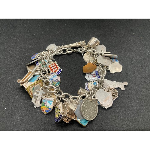 15 - HALLMARKED SILVER CHARM BRACLET WITH 37 SILVER CHARMS & 4 ADDITIONAL CHARMS NOT SILVER W76.1G