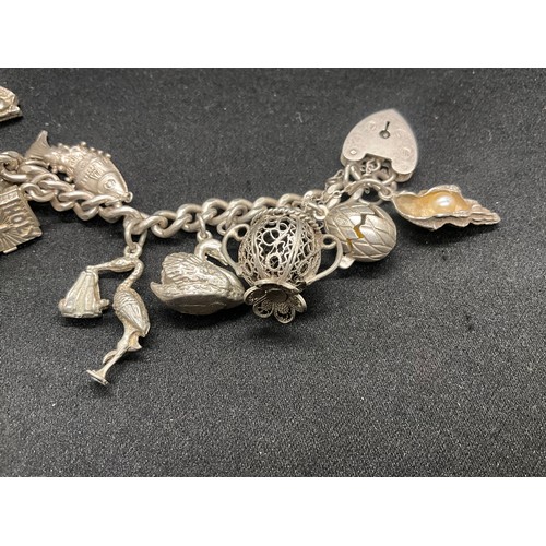 19 - SILVER CHARM BRACELET (TESTED) WITH 20 SILVER CHARMS W69.5G - ENGLISH HALLMARK LOCKET & CHAIN