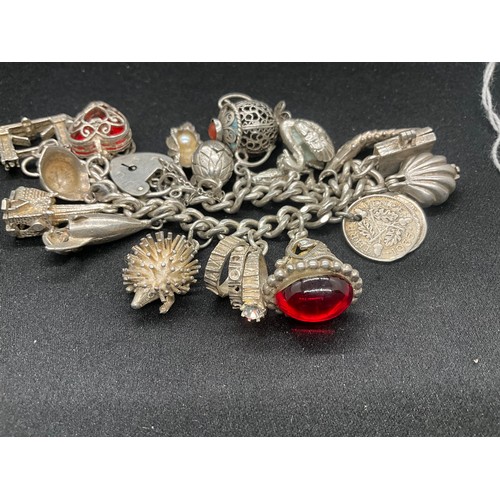 19 - SILVER CHARM BRACELET (TESTED) WITH 20 SILVER CHARMS W69.5G - ENGLISH HALLMARK LOCKET & CHAIN