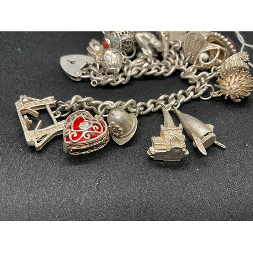 19 - SILVER CHARM BRACELET (TESTED) WITH 20 SILVER CHARMS W69.5G - ENGLISH HALLMARK LOCKET & CHAIN