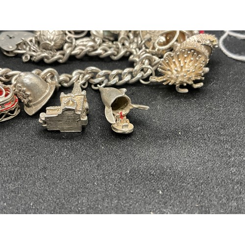 19 - SILVER CHARM BRACELET (TESTED) WITH 20 SILVER CHARMS W69.5G - ENGLISH HALLMARK LOCKET & CHAIN