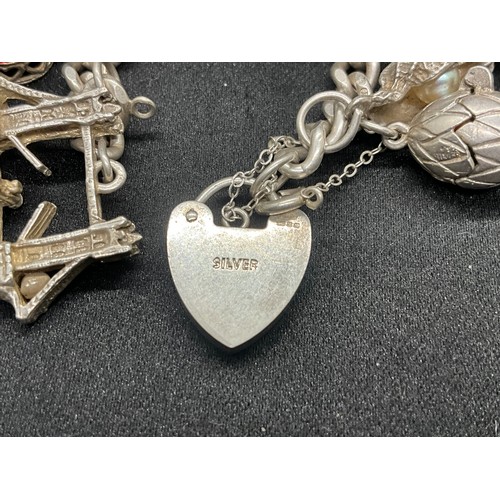 19 - SILVER CHARM BRACELET (TESTED) WITH 20 SILVER CHARMS W69.5G - ENGLISH HALLMARK LOCKET & CHAIN