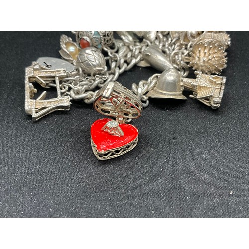 19 - SILVER CHARM BRACELET (TESTED) WITH 20 SILVER CHARMS W69.5G - ENGLISH HALLMARK LOCKET & CHAIN