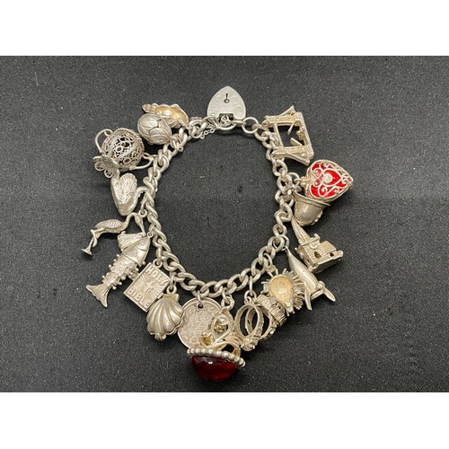 19 - SILVER CHARM BRACELET (TESTED) WITH 20 SILVER CHARMS W69.5G - ENGLISH HALLMARK LOCKET & CHAIN