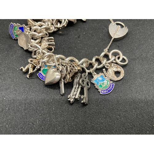 20 - HALLMARKED SILVER CHARM BRACELET WITH 28 SILVER CHARMS W71.9G WITH 3 ADDITIONAL NON SILVER CHARMS - ... 