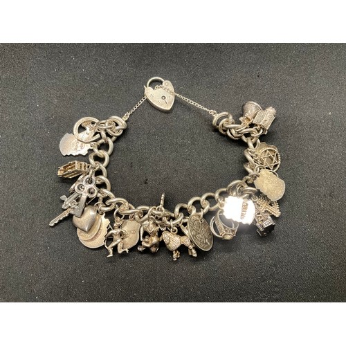 20 - HALLMARKED SILVER CHARM BRACELET WITH 28 SILVER CHARMS W71.9G WITH 3 ADDITIONAL NON SILVER CHARMS - ... 