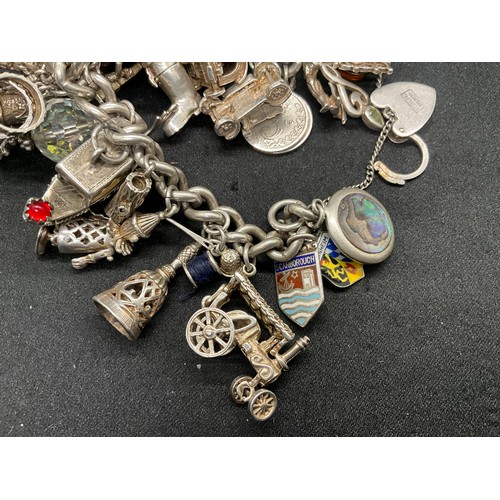 23 - HALLMARKED SILVER CHARM BRACELET WITH 23 SILVER & WHITE METAL CHARMS W113.8G - LOCKET IS CONTINENTAL... 