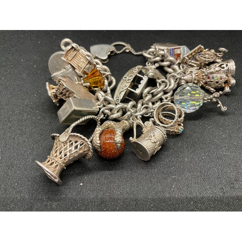 23 - HALLMARKED SILVER CHARM BRACELET WITH 23 SILVER & WHITE METAL CHARMS W113.8G - LOCKET IS CONTINENTAL... 
