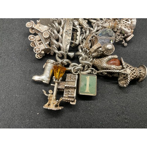 23 - HALLMARKED SILVER CHARM BRACELET WITH 23 SILVER & WHITE METAL CHARMS W113.8G - LOCKET IS CONTINENTAL... 
