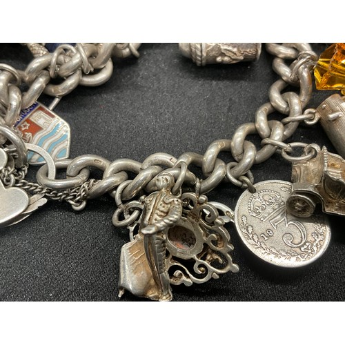 23 - HALLMARKED SILVER CHARM BRACELET WITH 23 SILVER & WHITE METAL CHARMS W113.8G - LOCKET IS CONTINENTAL... 