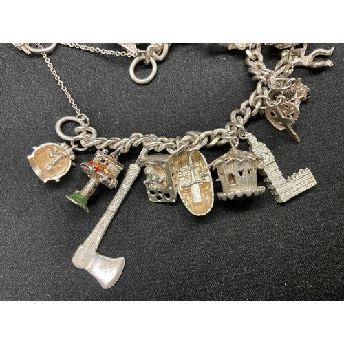 25 - SILVER CHARM BRACELET (TESTED) WITH 20 SILVER & WHITE METAL CHARMS W78.1G - LOCKET & CHAIN ENGLISH H... 