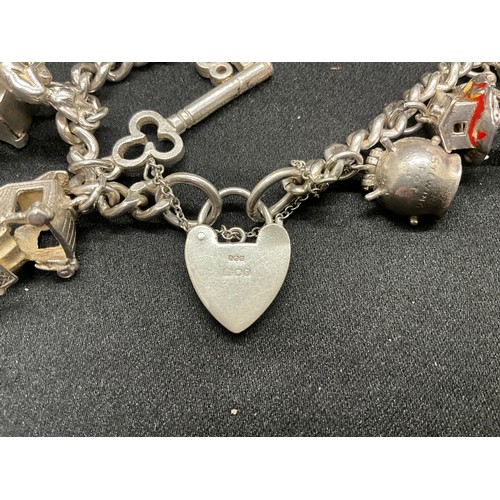 25 - SILVER CHARM BRACELET (TESTED) WITH 20 SILVER & WHITE METAL CHARMS W78.1G - LOCKET & CHAIN ENGLISH H... 